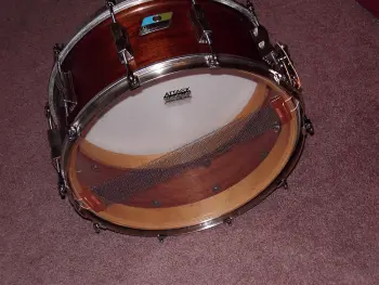 What is the definition of a real drum builder as opposed to a Drum assembler?