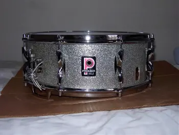 What is the definition of a real drum builder as opposed to a Drum assembler?