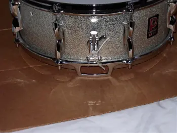 What is the definition of a real drum builder as opposed to a Drum assembler?