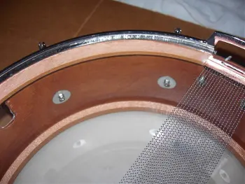 What is the definition of a real drum builder as opposed to a Drum assembler?