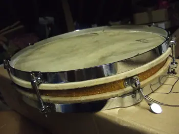 Can anyone help identify this vintage pancake snare?