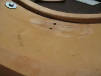 Repairing a dent in a drum