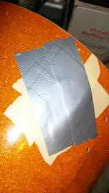 Hillbilly repairs on a wrecked bass drum