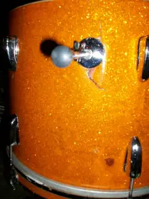 Hillbilly repairs on a wrecked bass drum