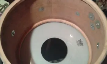 Please help identify the shell material on these Olympic By Premier drums