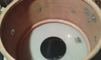 Please help identify the shell material on these Olympic By Premier drums