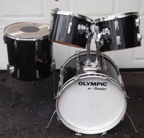 Please help identify the shell material on these Olympic By Premier drums