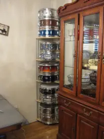 Here is a great inexpensive shelf for snare display $39.00