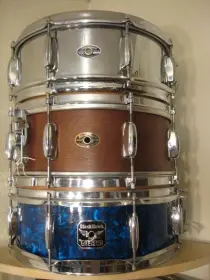 Here is a great inexpensive shelf for snare display $39.00