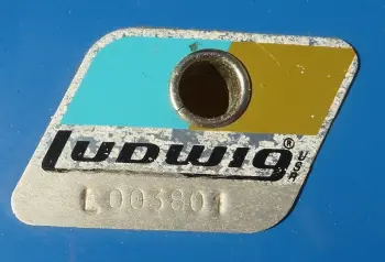 Blue/Olive badges with L before the serial?