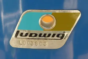 Blue/Olive badges with L before the serial?