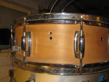 Ludwig Muffler screw under the knob or over the knob???