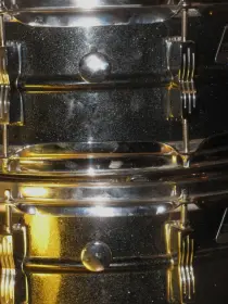 Ludwig Muffler screw under the knob or over the knob???